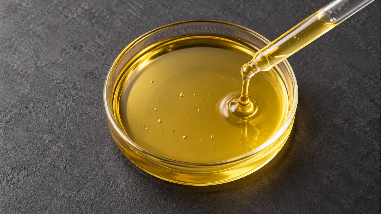 Close view of yellow sorbitan monooleate liquid